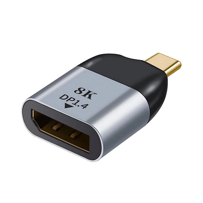 A silver-colored TECPHILE 8K DP 1.4 to Type-C Adapter with a female DisplayPort connector on one end and a Type-C port on the other.