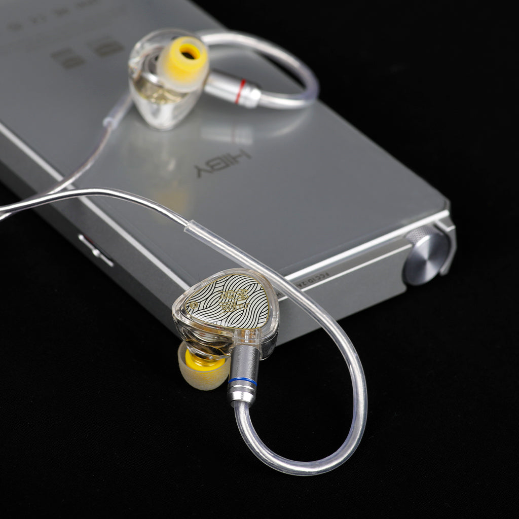 TANGZU Wan'er SG 2 IEMs with silver cable plugged into HiBy audio player, highlighting compatibility and high-end audio setup.