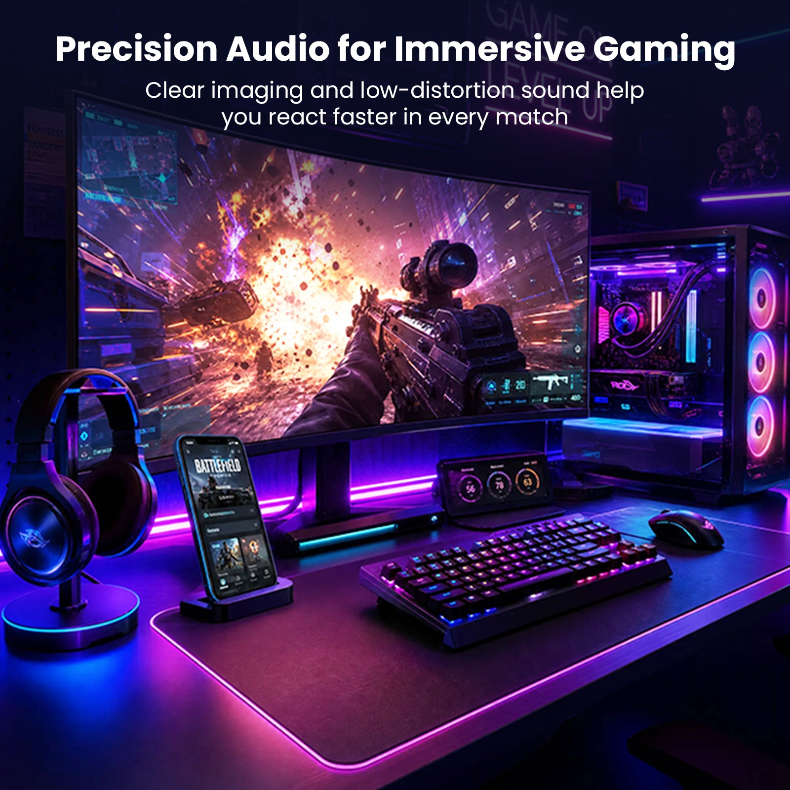 Gaming setup with colorful LED-lit monitor, headphones, and gaming accessories