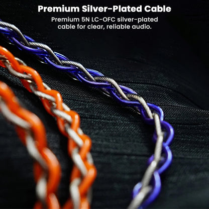 Close-up of silver-plated cables with text on a black background