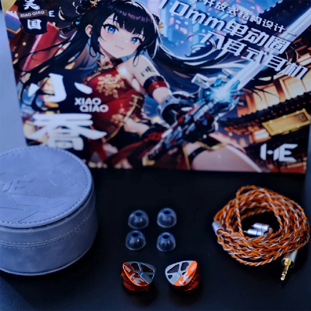 Audio equipment with earbud casings, cables, and a character illustration on packaging