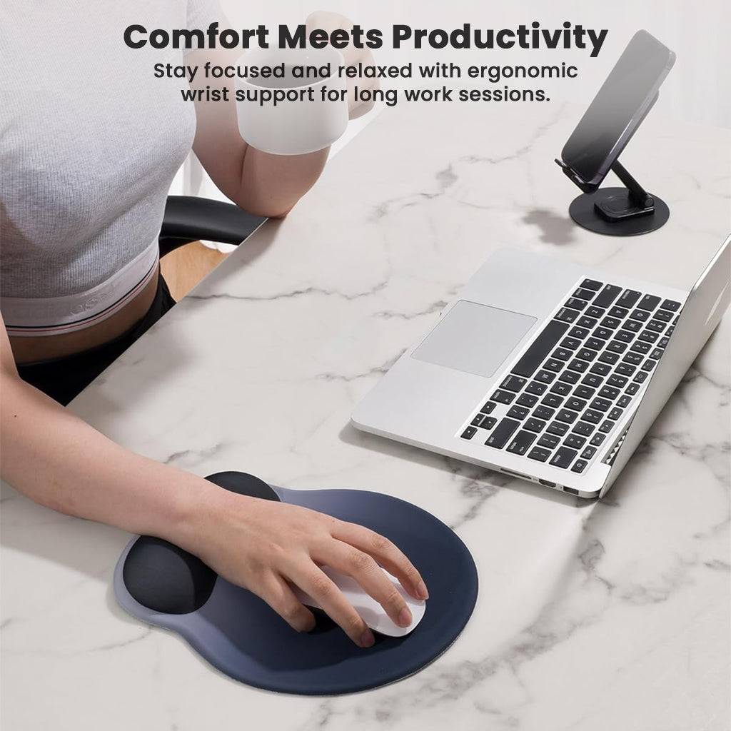 User working at a desk with TECPHILE ergonomic mouse pad, demonstrating wrist support for enhanced productivity and comfort.