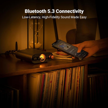 Fosi Audio MC101 Bluetooth Stereo Amplifier in use with a smartphone, showcasing Bluetooth 5.3 connectivity for low-latency audio streaming.