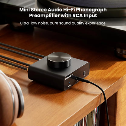 NEOHIPO TP10 Phono Preamp connected to turntable on wooden desk, showcasing RCA input and ultra-low noise audio output.