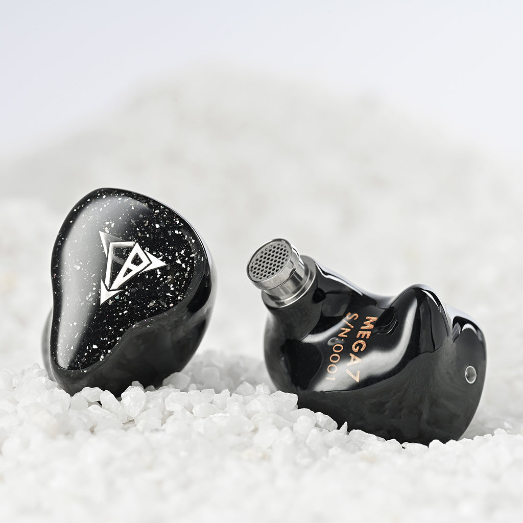 Hisenior Mega7 In-Ear Monitors placed on white crystals, showing off glossy black finish and advanced nozzle design for superior audio.
