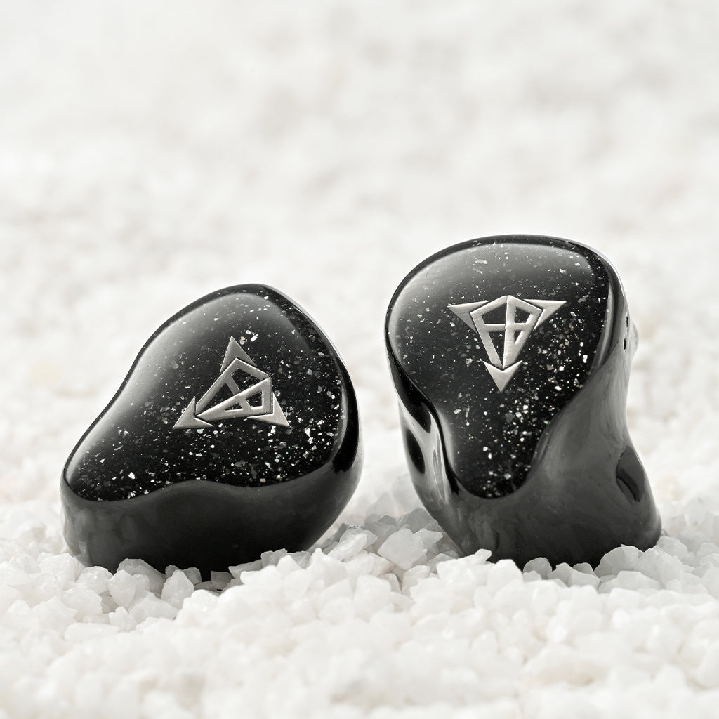 Front-facing Hisenior Mega7 IEMs with silver logo and starry black finish, crafted for immersive listening and stylish aesthetics.