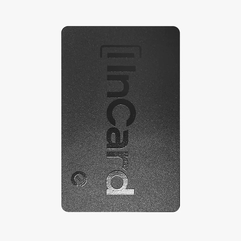 Close-up of InCard Finder Wireless GPS Tracker, showcasing sleek black finish and compact credit card-sized form factor.