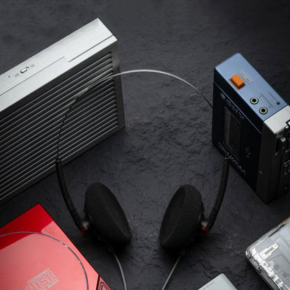 MOONDROP On-ear Headphone displayed with vintage audio equipment, showcasing its retro aesthetic and wired connectivity.