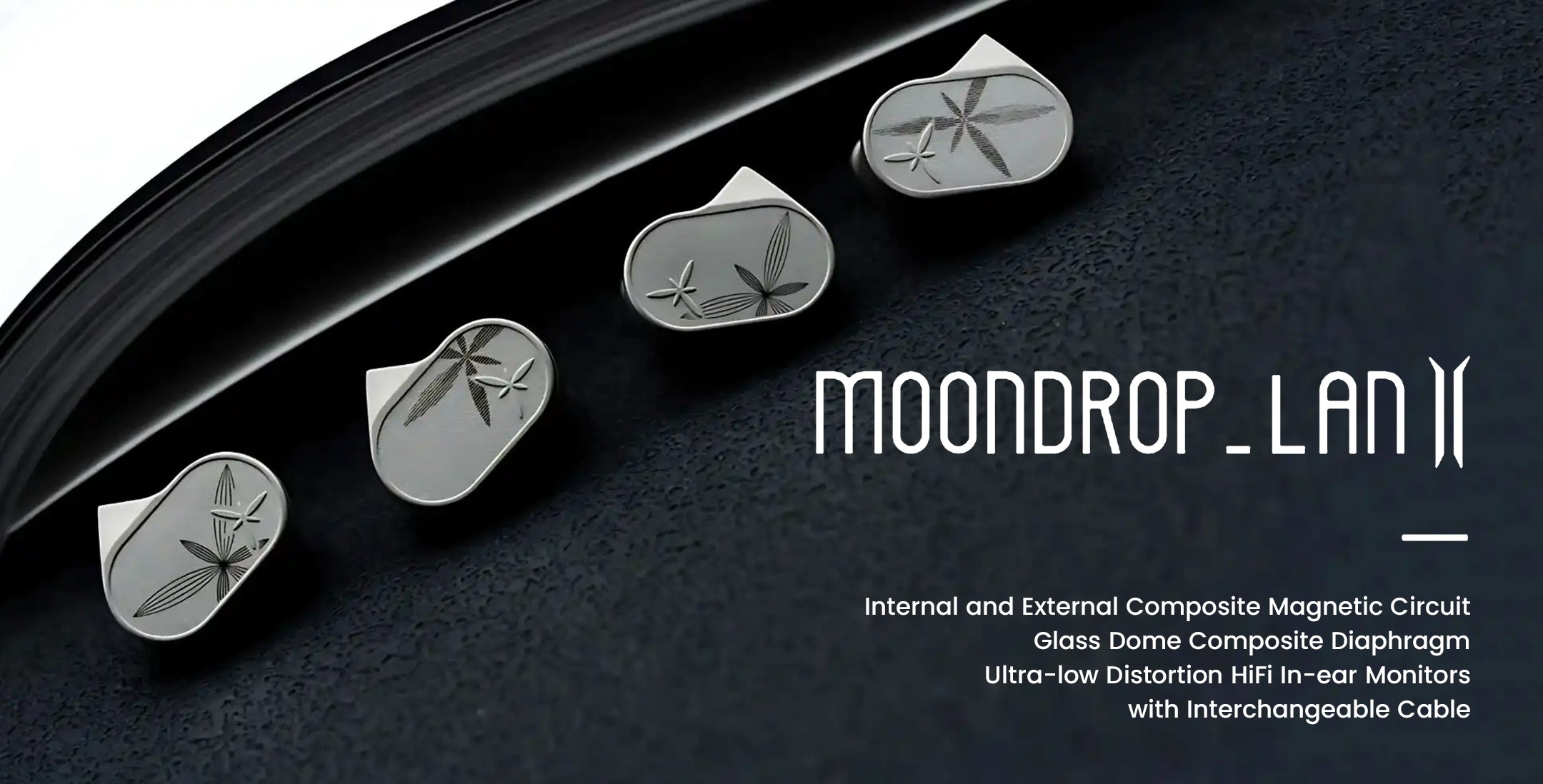 An advertisement image for the MOONDROP LAN II in-ear monitors (IEMs). Four silver-colored earpieces, two on the left and two on the right, are arranged diagonally on a dark, textured surface that suggests a vinyl record's groove. Each earpiece has a laser-engraved design resembling stylized leaves or stars.