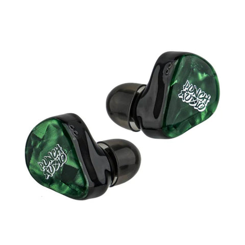Close-up of Punch Audio Portazo In-Ear Monitors featuring handcrafted green resin shells and dual planar driver configuration.