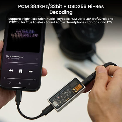 QUESTYLE M15C DAC/Amp connected to a smartphone, decoding PCM 384kHz/32bit and DSD256 for high-resolution audio playback on the go.