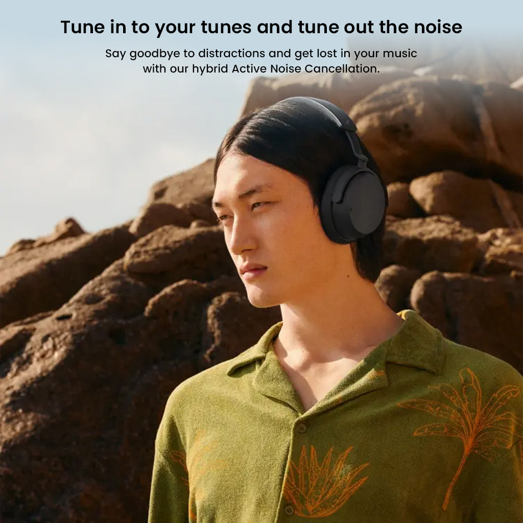 Model using Sennheiser ACCENTUM Wireless Over-Ear Headphones in nature, showcasing hybrid active noise cancellation for distraction-free sound.