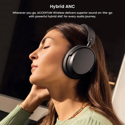 Woman enjoying music with Sennheiser ACCENTUM Wireless Over-Ear Headphones, highlighting hybrid ANC for premium sound on the go.