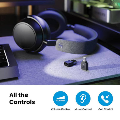Sennheiser BTD - 700 Bluetooth Dongle beside headphones on a desk, showcasing volume, music, and call control features.