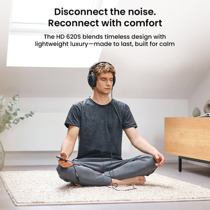 User meditating with Sennheiser HD 620S headphones, promoting comfort and noise isolation with lightweight luxury design for calm listening.