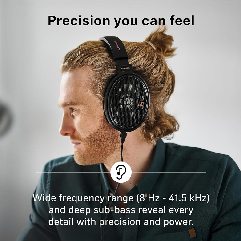 Man wearing HD 660S2 wired headphones, showcasing wide frequency range and deep sub-bass for audiophile-level sound precision.