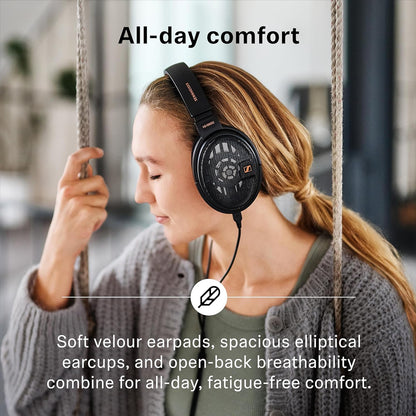 Woman enjoying HD 660S2 headphones with soft velour earpads and open-back design for all-day, fatigue-free comfort.