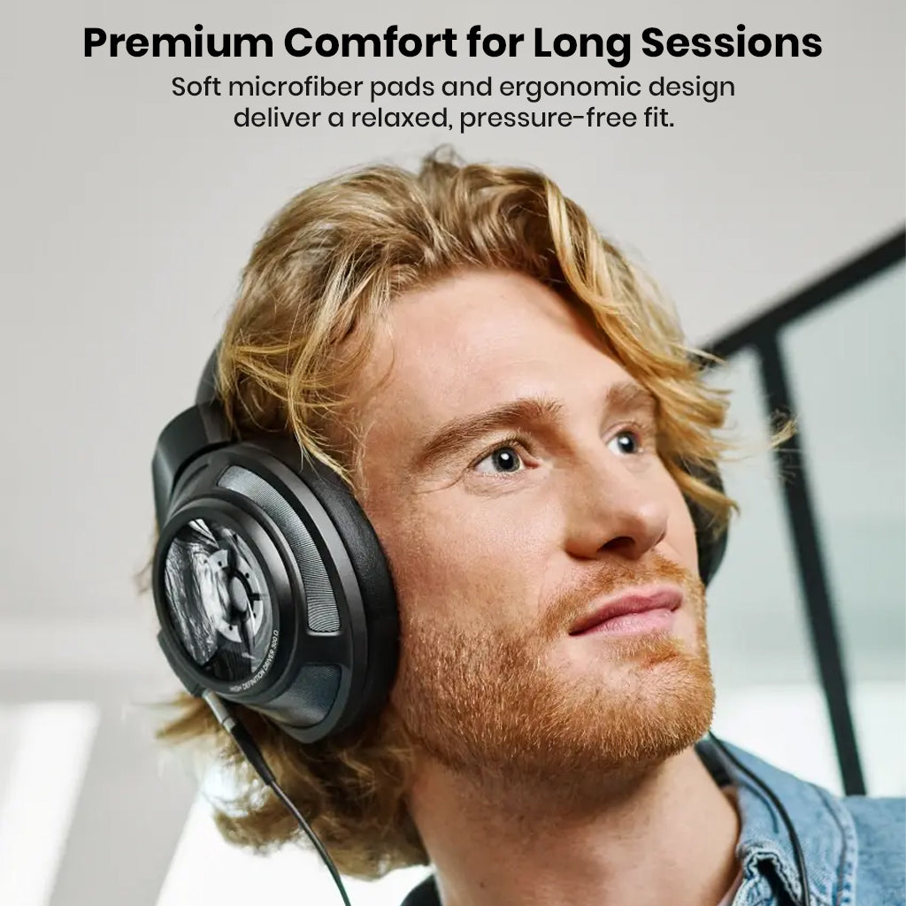 Man wearing Sennheiser HD 820 headphones with soft microfiber pads, ideal for long listening sessions with ergonomic comfort.