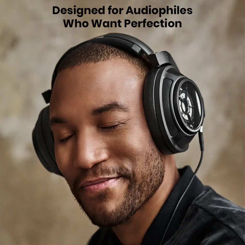 Smiling man enjoying music with Sennheiser HD 820 headphones, designed for audiophiles seeking high-end sound perfection.
