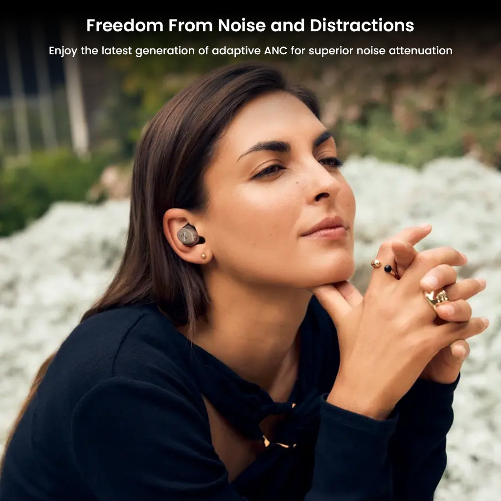 Woman relaxing with Sennheiser Momentum True Wireless 4 earbuds, featuring adaptive ANC for immersive, distraction-free listening.