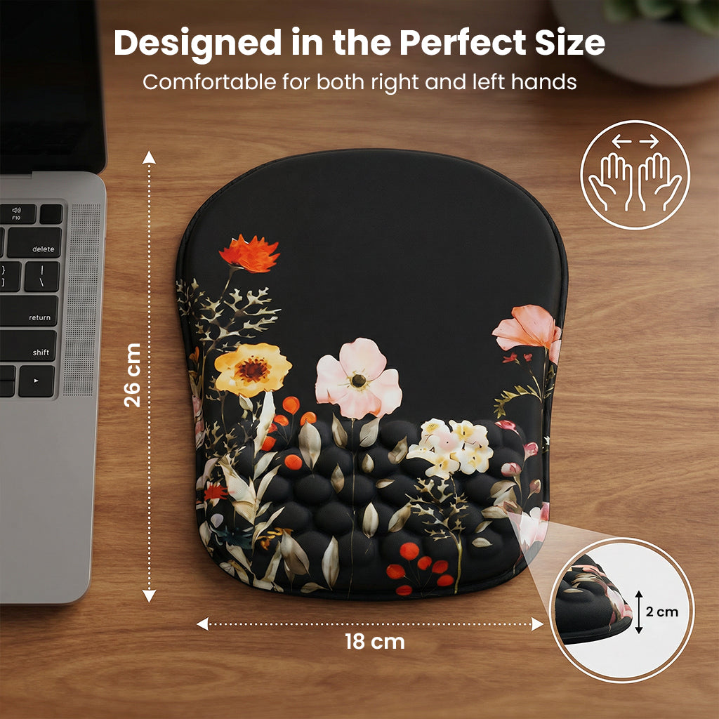 Black floral mouse pad with size dimensions on wooden desk