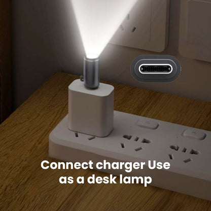 TECPHILE USB-C Mini Flashlight Adapter used as a desk lamp when connected to a charger, providing hands-free lighting in compact spaces.