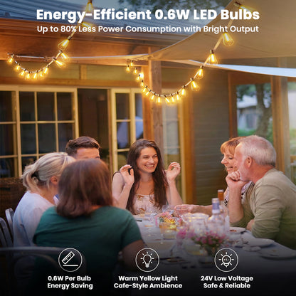 TECPHILE – ST38 50ft outdoor string lights with waterproof and dimmable LED bulbs hanging over a patio dinner setting, creating a warm yellow café-style ambience. Ideal for home & garden lighting with energy-efficient 0.6W bulbs and 24V low voltage safety.