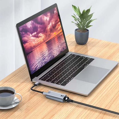 TECPHILE Type-C Ethernet Adapter connected to a laptop, enabling fast and stable wired internet access for improved productivity.