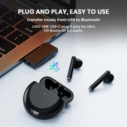 TempoTec LHDC ONE USB-C Bluetooth Transmitter plugged into laptop, streaming audio to wireless earbuds with Bluetooth 5.3.