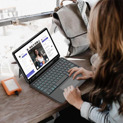 User working on Samsung Galaxy Tab S9 with YJ-S9 Keyboard Case featuring backlit keyboard and trackpad in a cafe setting.