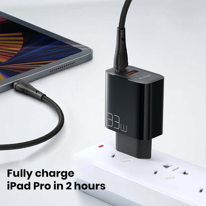 Mcdodo 33W Gan Charger plugged in, fast charging iPad Pro to full in 2 hours with included Type-C cable.