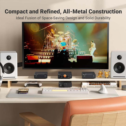 Fosi Audio-P4 Mini Preamp - Headphone Amplifier setup in a home entertainment system with speakers and monitor, showcasing compact all-metal design.