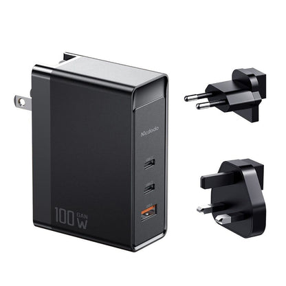 MCDODO 100W GaN charger with dual USB-C and USB-A ports, includes EU and UK plug adapters for universal compatibility.