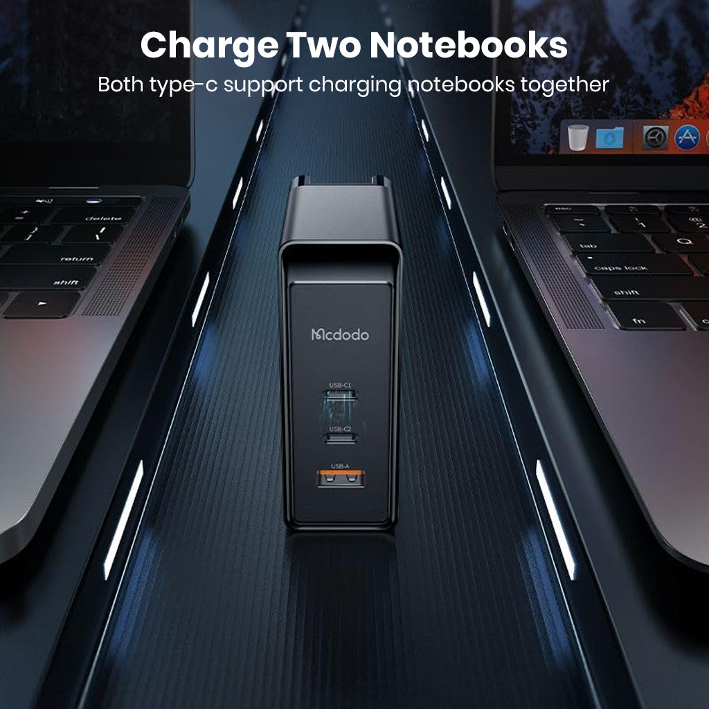 MCDODO 100W GaN charger powering two laptops simultaneously via dual USB-C ports, ideal for multitasking professionals.
