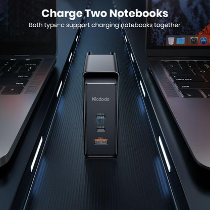 MCDODO 100W GaN charger powering two laptops simultaneously via dual USB-C ports, ideal for multitasking professionals.