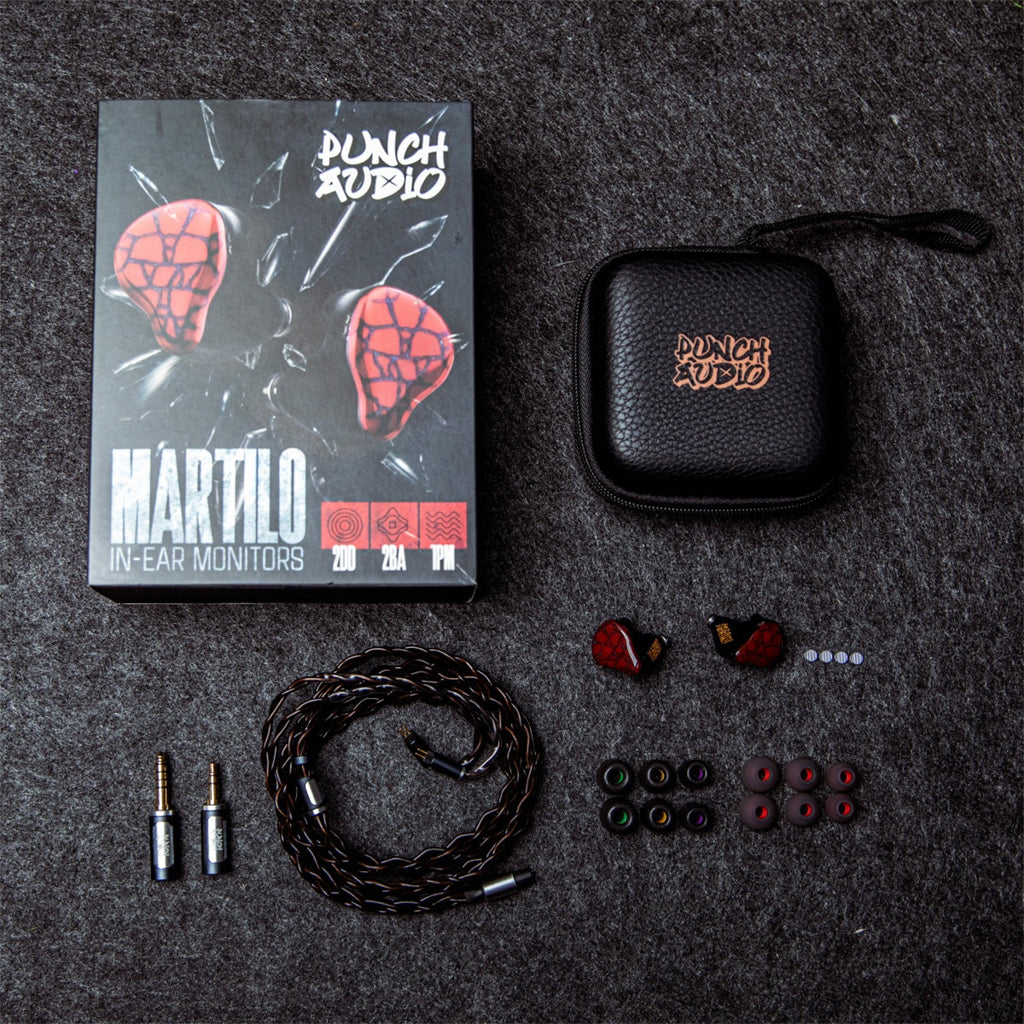 Complete Punch Audio Martilo 1 IEM package with ear tips, braided cable, adapters, carrying case, and retail box on dark textured surface.
