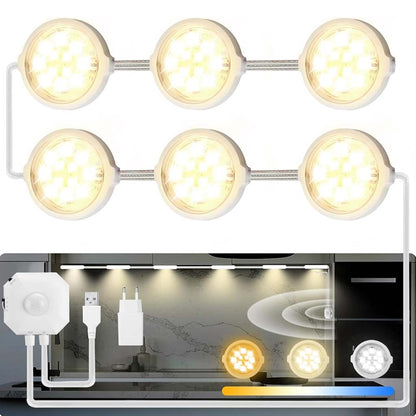 TECPHILE Smart Motion Sensor LED Cabinet Lamp setup showing warm white puck lights installed under kitchen cabinets for ambient lighting.