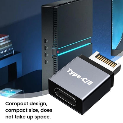 Compact TECPHILE USB Type-E to USB-C adapter shown in a desktop setup, highlighting its space-saving and sleek design.