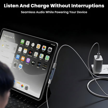 AUDIOCULAR A14X adapter used with a tablet, allowing seamless charging and audio output at the same time.