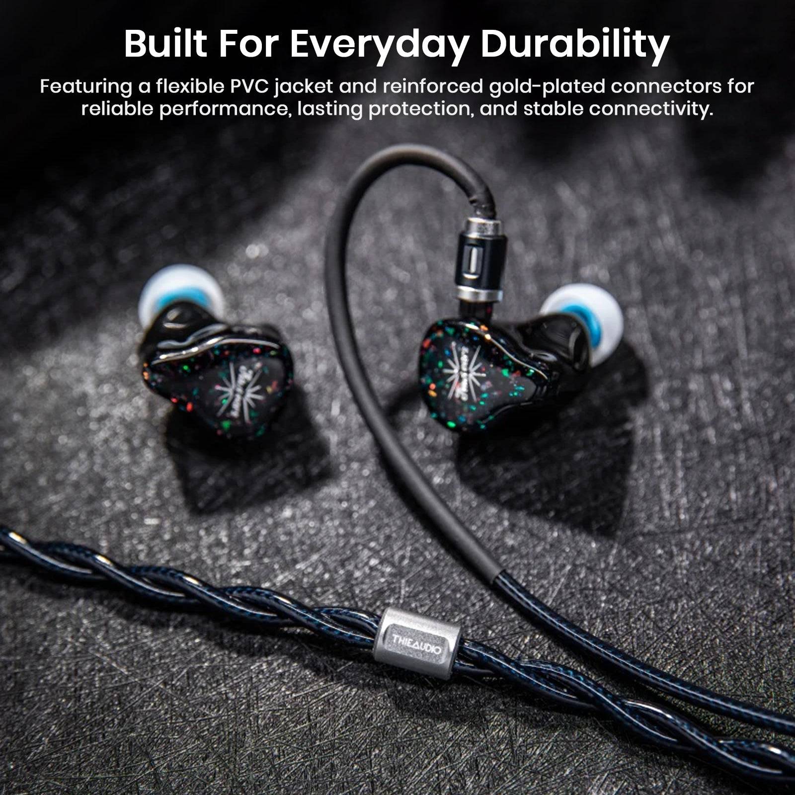 THIEAUDIO Midnix premium copper cable with in-ear monitors on textured black surface, highlighting lightweight design