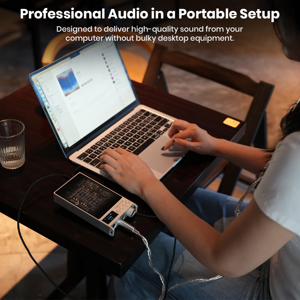 Questyle SIGMA Pro DAC/Amp connected to laptop, offering professional-grade audio in a portable setup without bulky equipment.